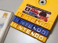 Some Famicom Disks. Note the indentations/molding of the ‘I’ and ‘N’ in Nintendo color/