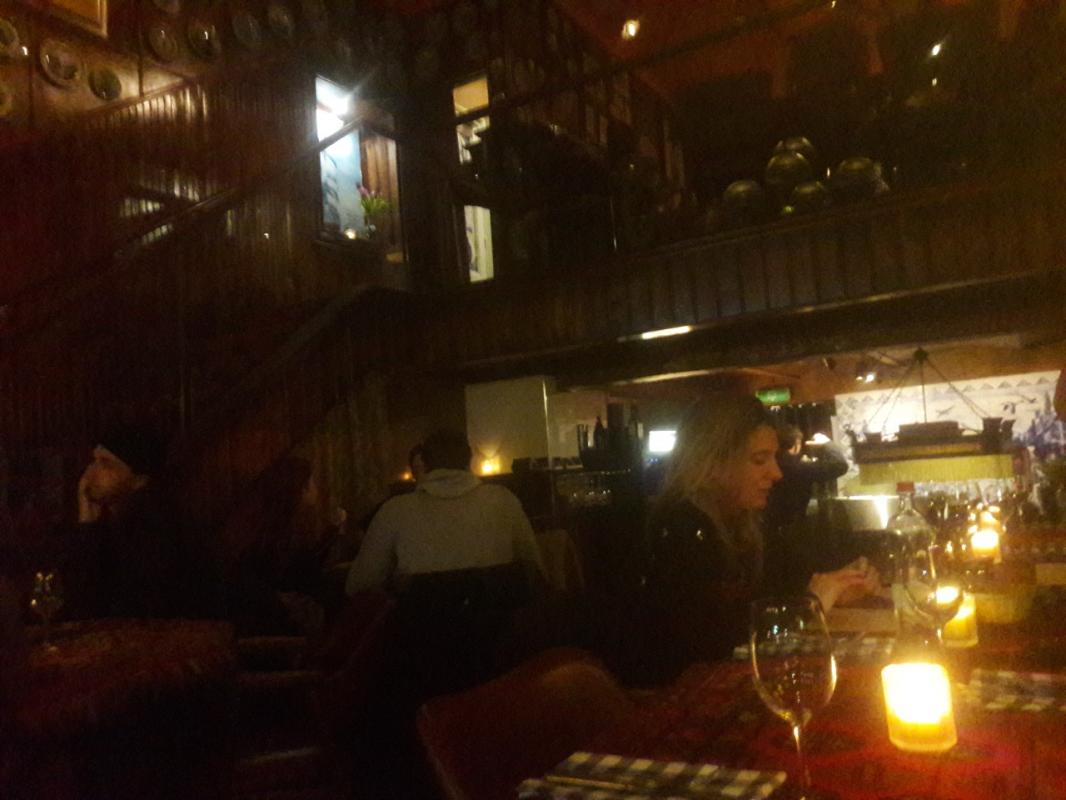A Dutch pub, very similar to a German pub: very dark and lit by a few candles, entirely made with wo