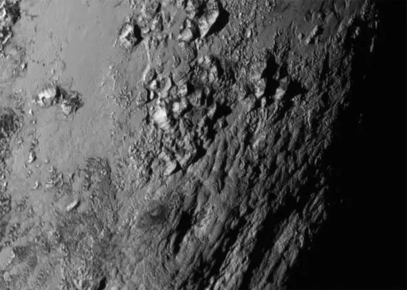 Photos of an Icy Mountain range near the equator of Pluto, captured by NASA's New Horizons mission i