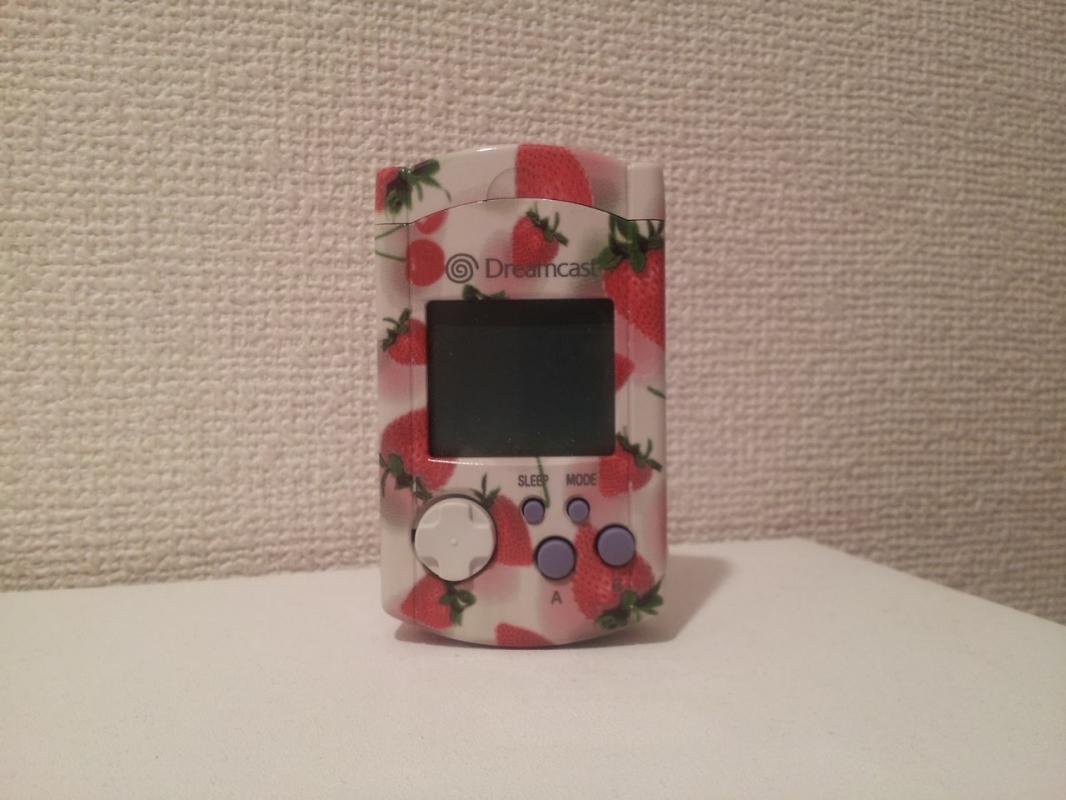 Strawberry VMU, another edition which you could purchase at Dreamcast-Direct with points