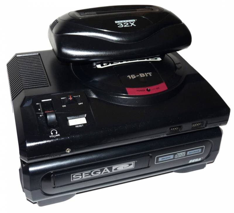 A /* Sega Mega Drive */ (first version) with the /* SEGA CD */ add-on on the bottom, to load games f