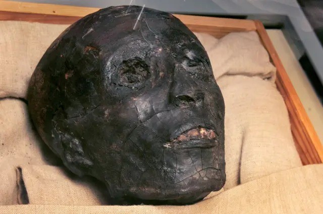 The mummy of Tutankhamun. The body appears to have been burned.