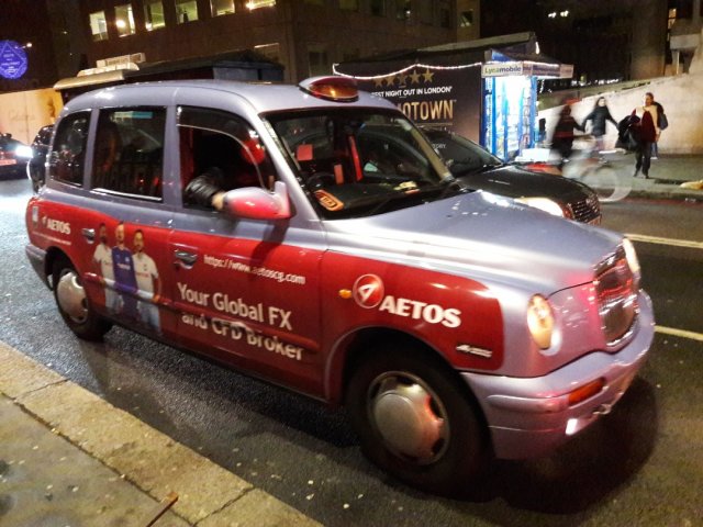 Advertising on taxis in London: AETOS Your global FX and CFD broker.