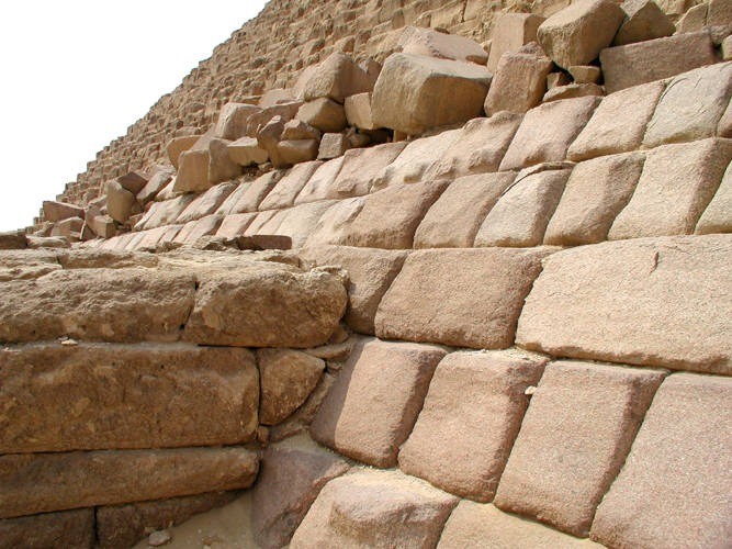 The casing stones on Menkaure's Pyramid were never finished. The photo shows the East face of th