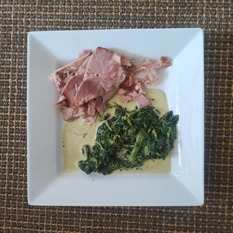 Boiled meat with spinach and cream