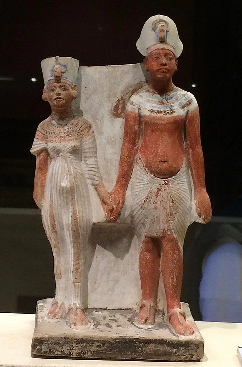 Pharaoh Akhenaten and his wife Nefertiti holding hands, at the Louvre Museum, Paris