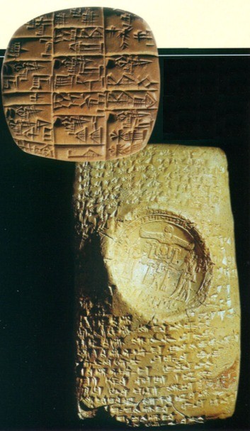 Two examples of cuneiform writing. Opposite clay tablet from the Archive of the Royal Palace of Ebla
