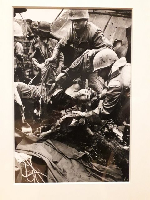 Wounded North Vietnamese soldier retrieved from hi bunker by US marines, Hue