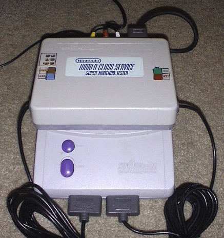 Tester plugged into SNES cart slot.