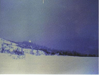 A giant light hovers over a peak in Hessdalen Norway. Photo by Leif Havik/Project Hessdalen.