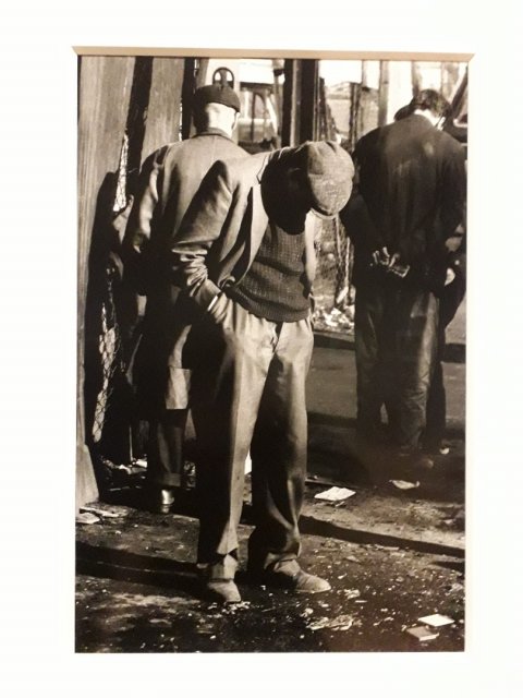 Homeless men sleeping while standing, Whitechapel, London