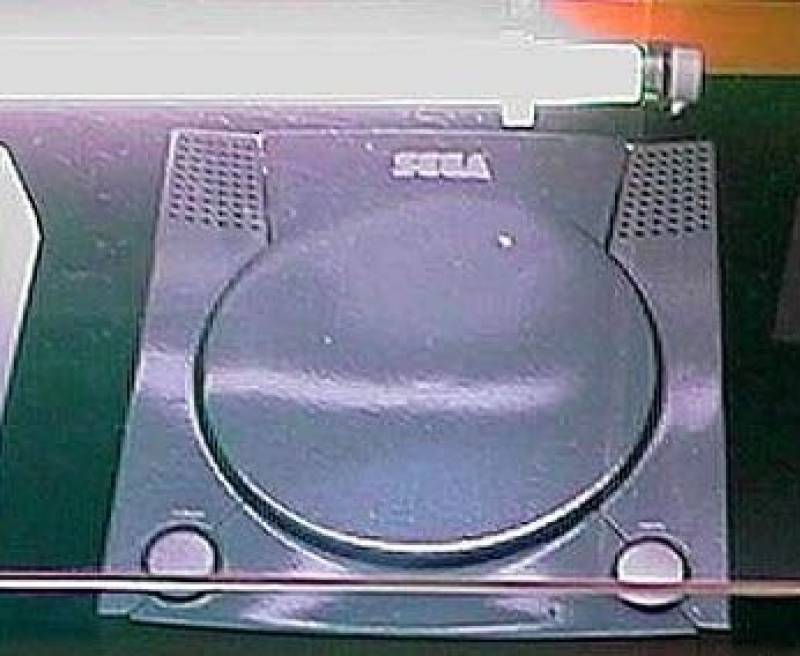 Late prototype of the Sega Dreamcast. It looks quite similar to the final version. The 2 round butto