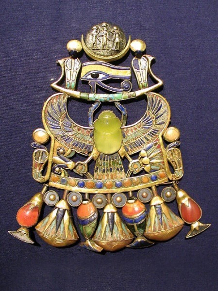 Tutankhamun's breastplate features a scarab carved in desert glass in the center