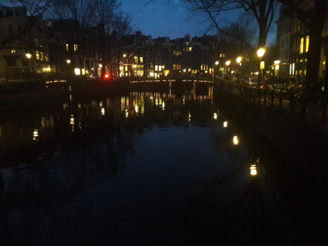 Amsterdam's canal photographed at night.