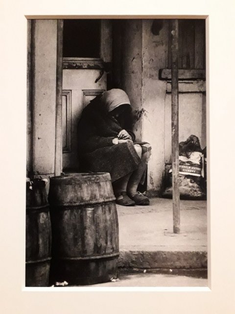 Woman sleeping in a shop doorway, Aldgate East, London
